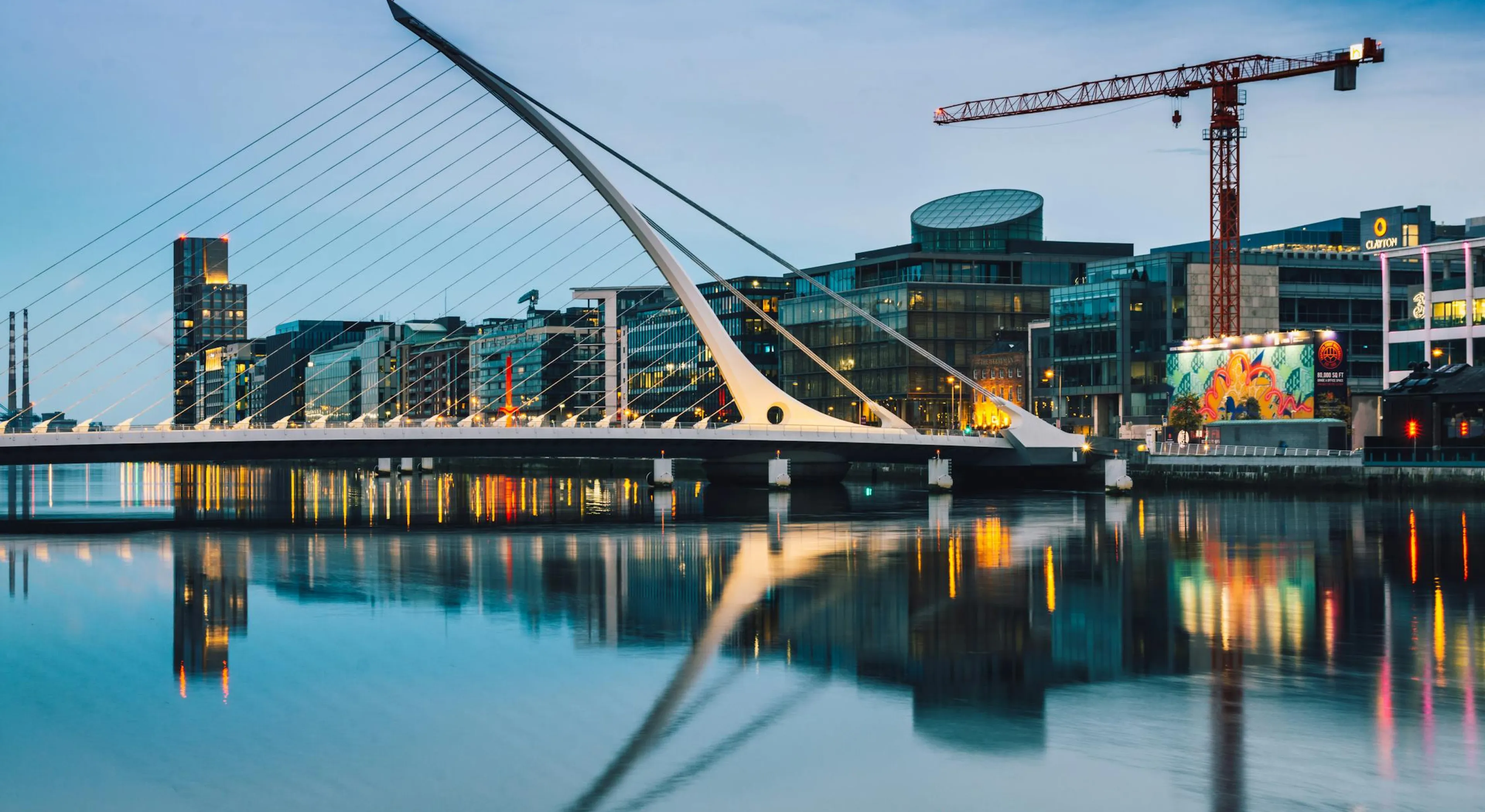 Cityscape view of a bridge and modern buildings at dusk